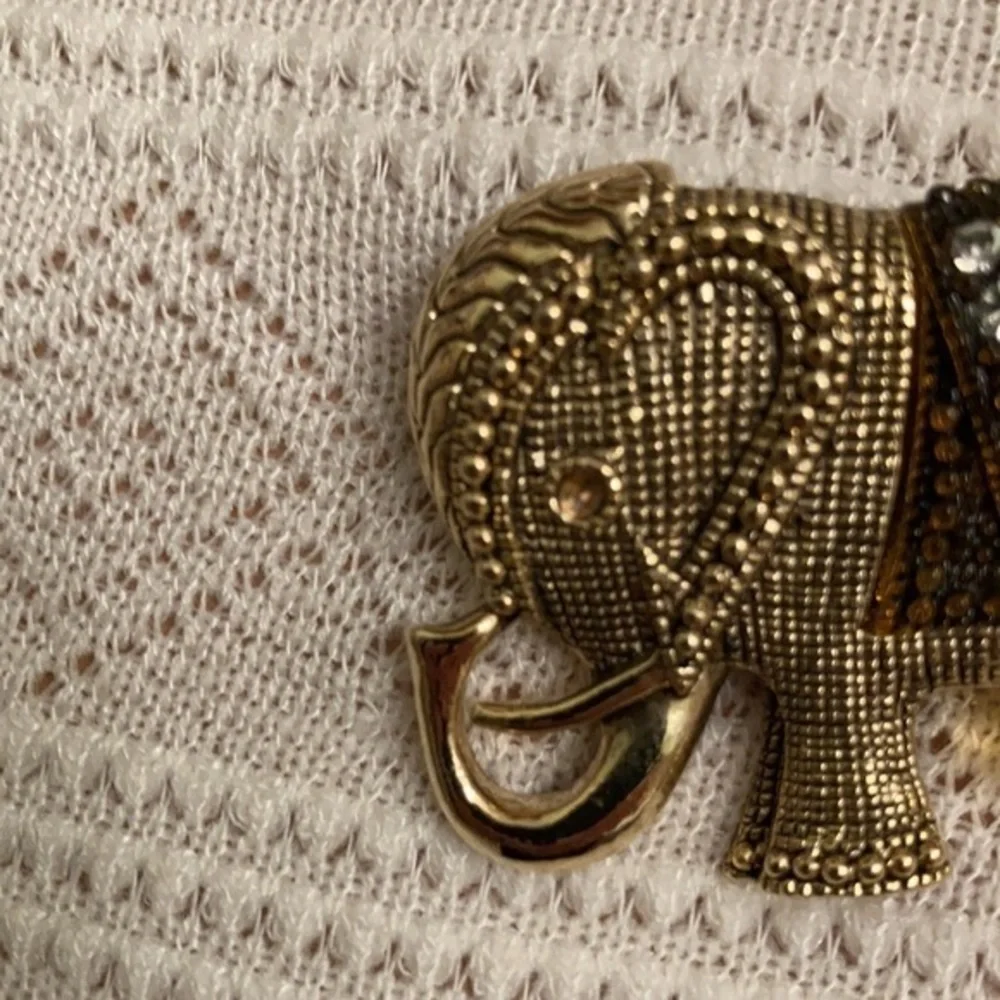Gorgeous gold tone and crystal elephant brooch